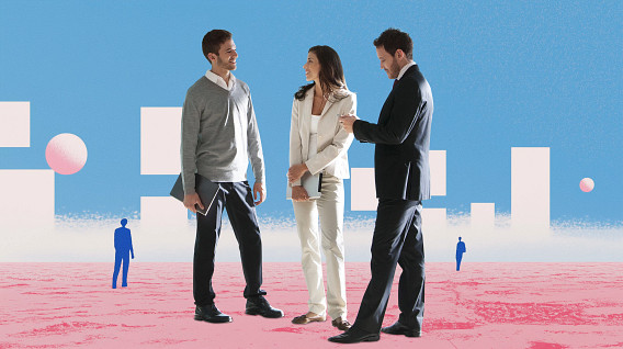 Three professionals, two men and a woman, stand together on a pink, abstract landscape under a bright blue sky with geometric white shapes and spheres. They appear engaged in a friendly conversation, dressed in business casual and formal attire. Distant figures are scattered in the background, adding depth to the scene. The image conveys collaboration and innovation.