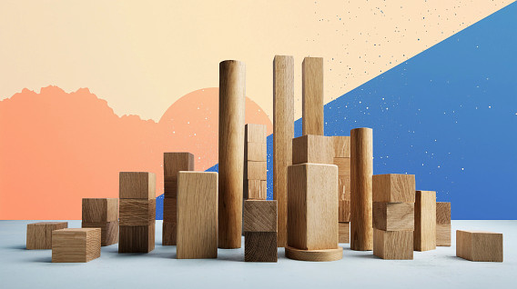A collection of wooden building blocks of various shapes and sizes is arranged in the foreground, creating an abstract cityscape. The background features a gradient with soft orange and blue sections, complemented by scattered specks that add texture. The composition evokes a sense of creativity and playfulness, with the natural wood contrasting against the colorful backdrop.