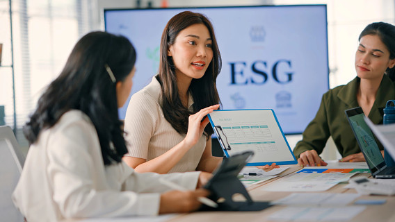 businesspeople in a meeting discussing ESG